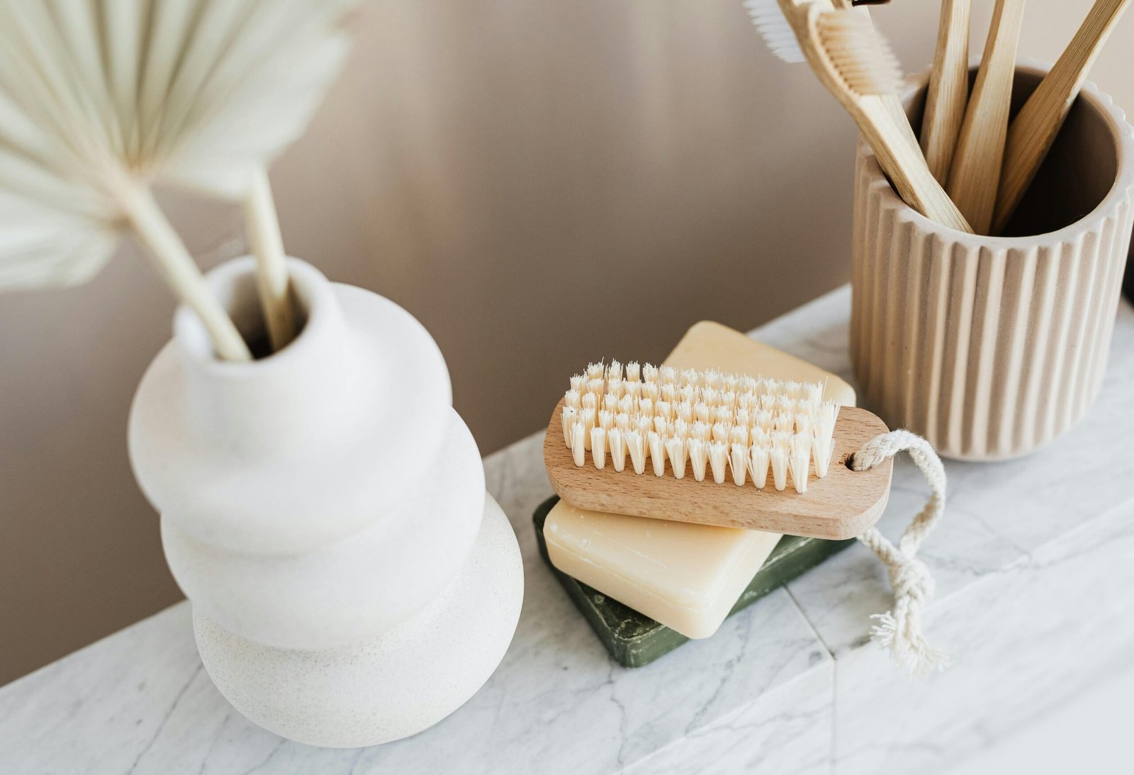 a wooden toothbrush and a toothbrush on a table
