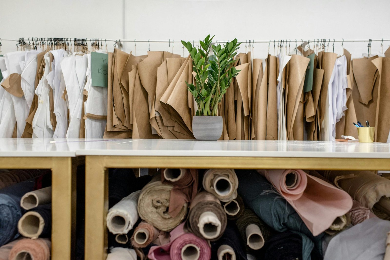 a bunch of clothes hanging on a rack
