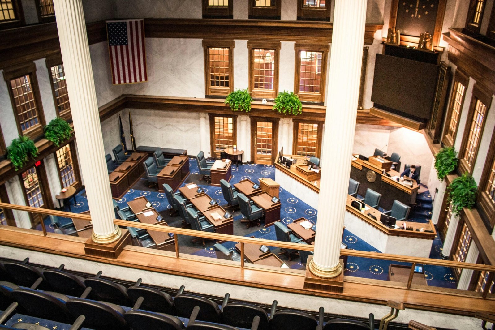 a large meeting room with a lot of chairs and tables