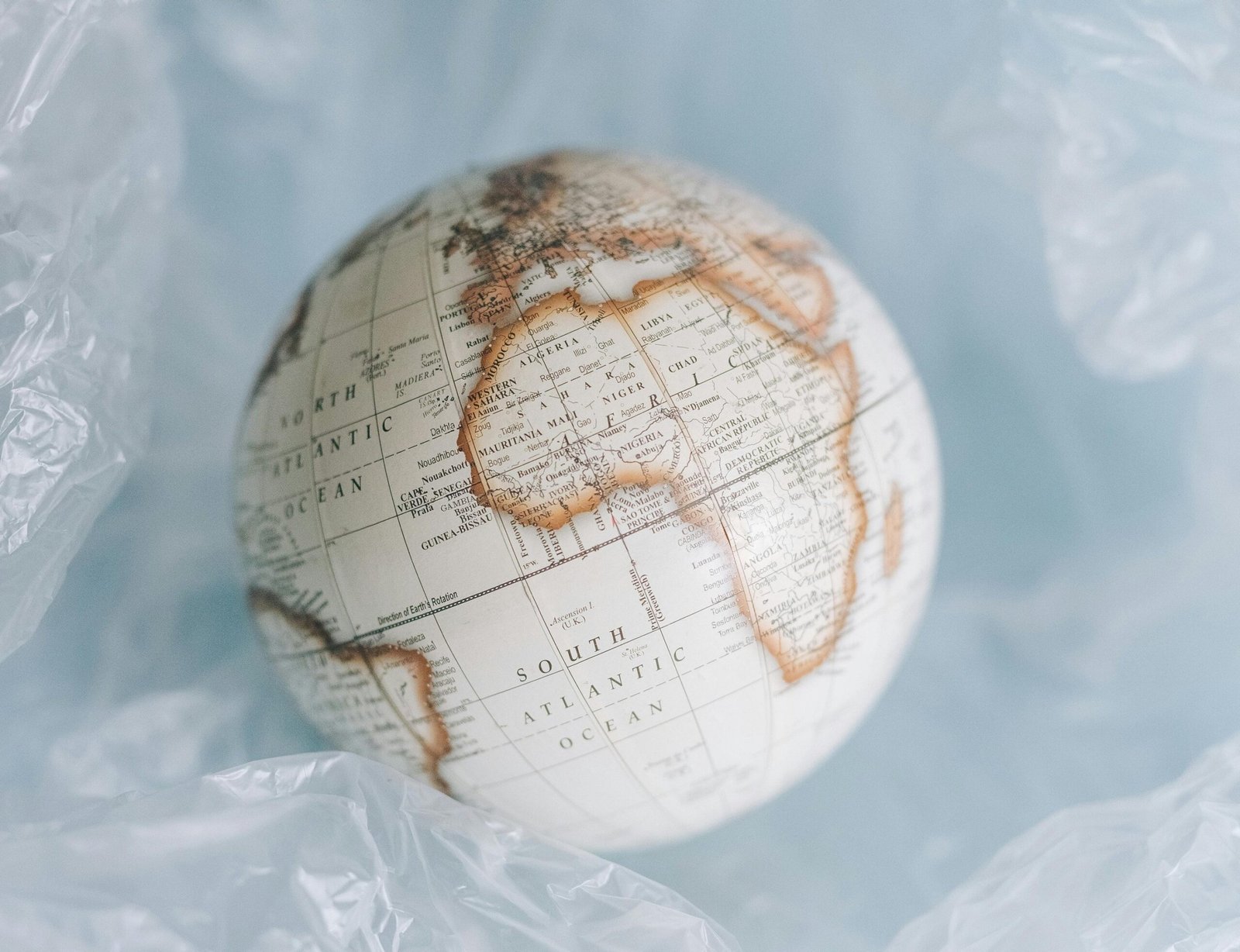 a globe in plastic wrap