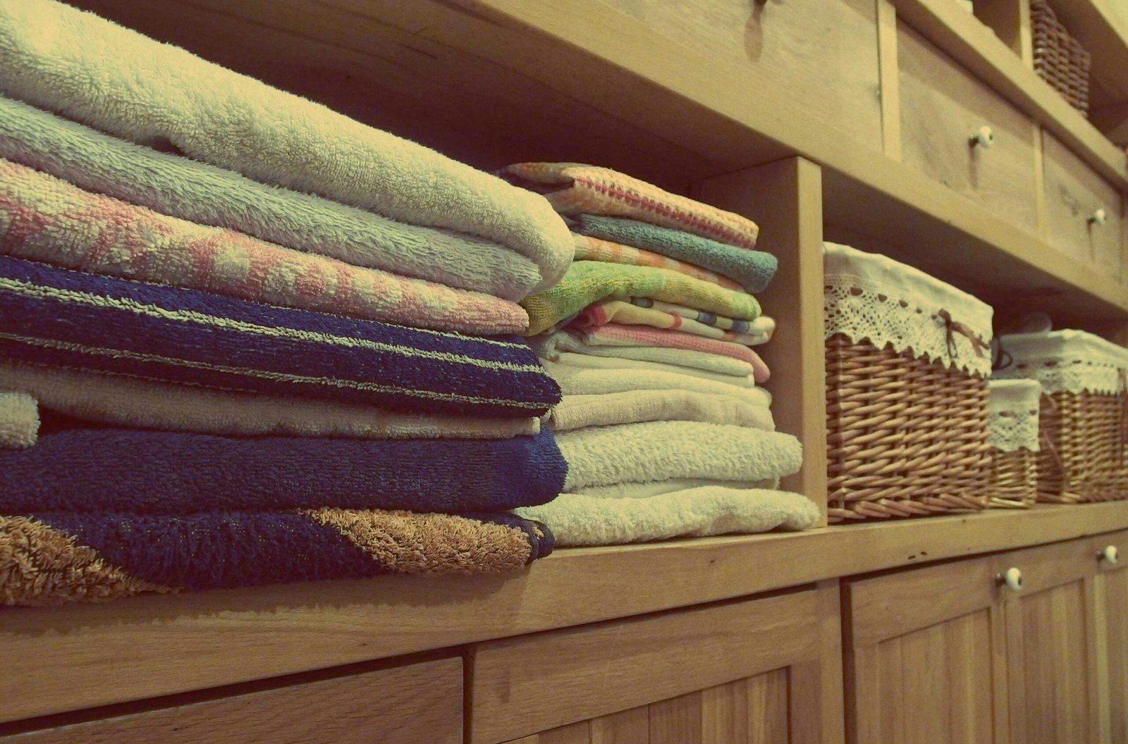 a bunch of towels and towels on a shelf
