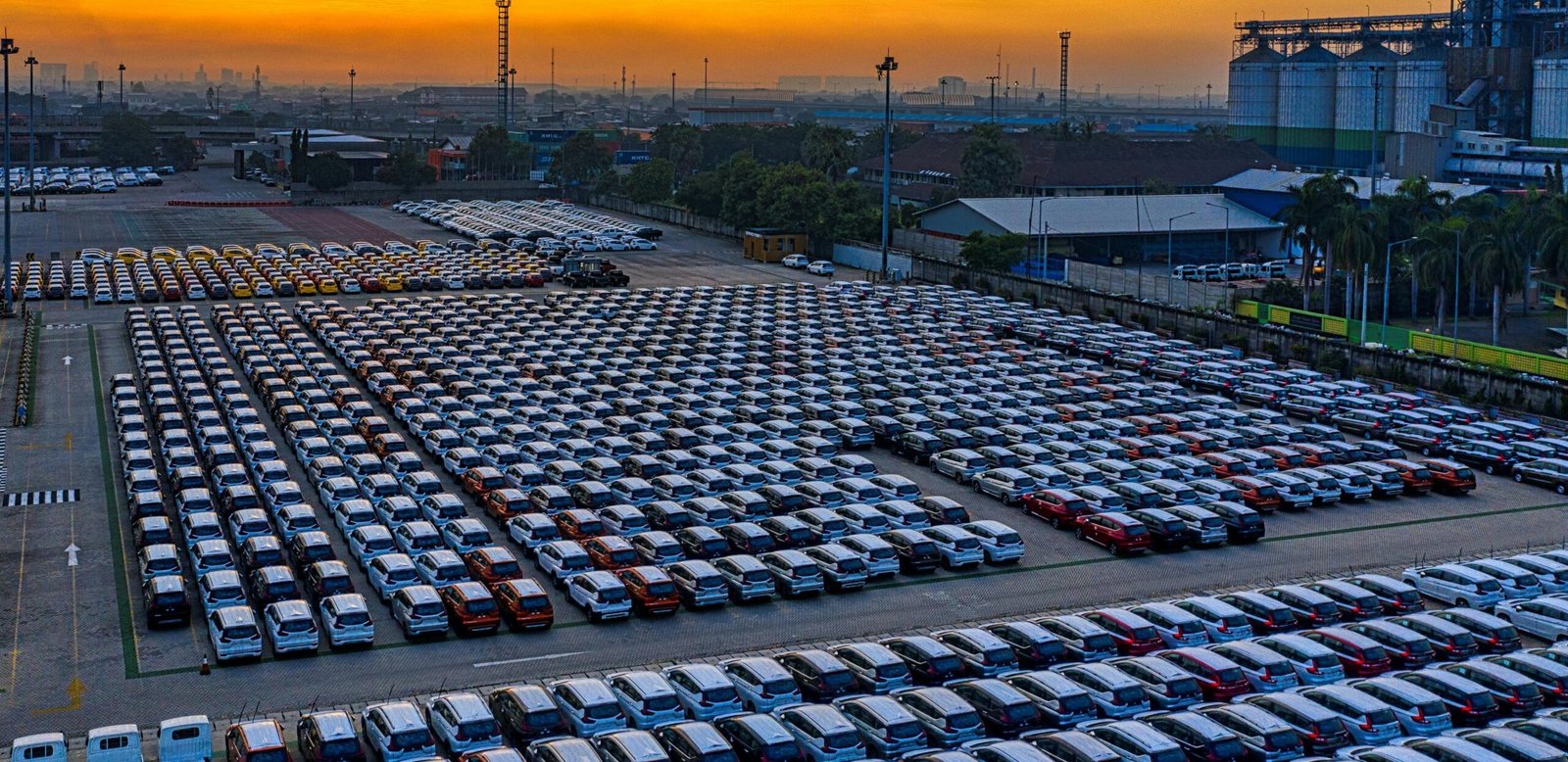 a parking lot full of electric cars parked in a parking lot