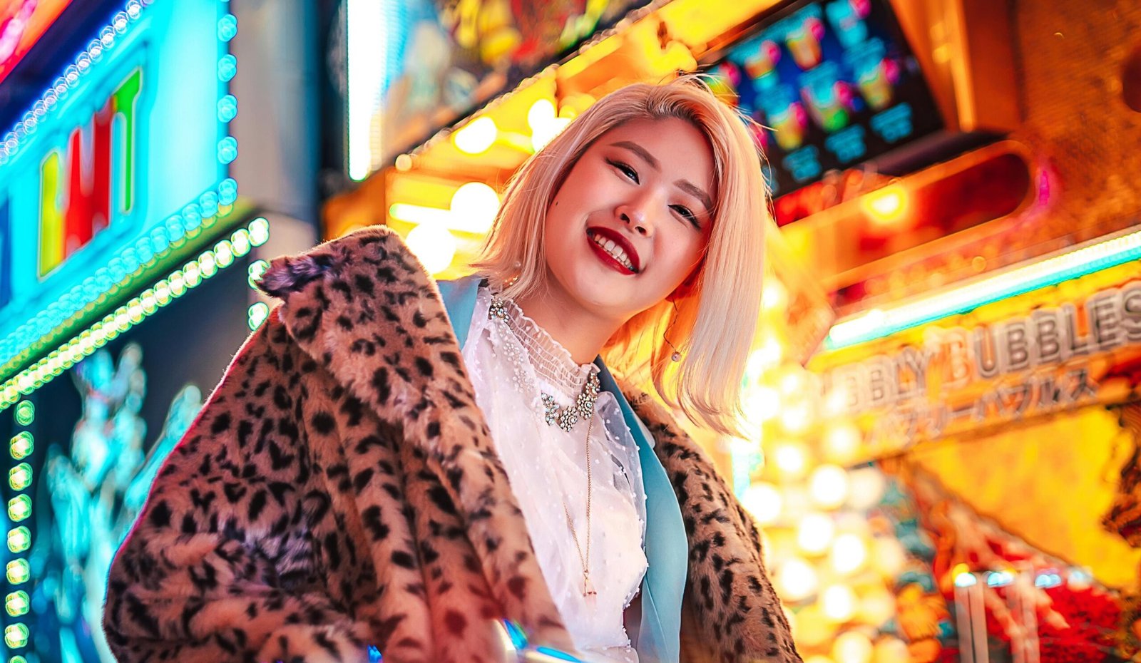 a woman in a leopard print coat in harajuku tokyo